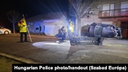 Police inspect the scene of the crash in Morahalom, Hungary, on December 14.