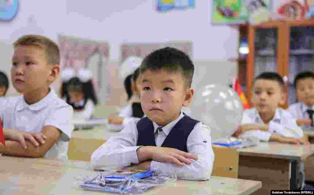 Kyrgyz first-graders sit attentively as class begins in Bishkek. An estimated 150,000 children entered the first grade this year in Kyrgyzstan.