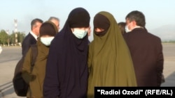 A plane brought the women and children to Dushanbe on May 21.
