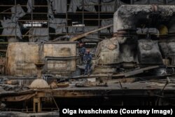 Emergency workers pick through Kharkiv’s heavily damaged thermal power plant after it was hit by a Russian missile in March.