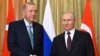 Russian President Vladimir Putin (right) and Turkish President Recep Tayyip Erdogan pose prior to talks in Sochi, Russia, on September 4.