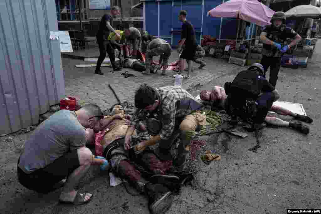 Injured people are given first aid at the scene.