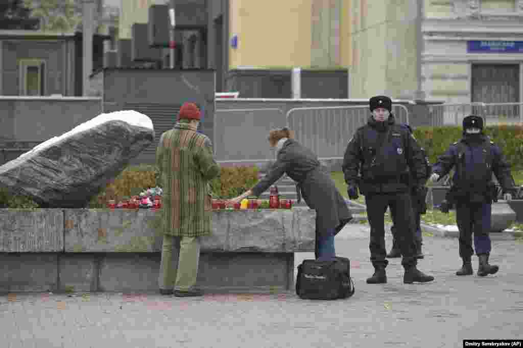 The Memorial human rights group said two police wagons were parked near the Solovetsky Stone memorial and only groups of three or fewer people were allowed to pass through. "For the first time, perhaps, when we came to the Solovetsky Stone, we saw that the square was cordoned off. Today, this is the attitude toward the memory of the victims of repression. Not to gather more than three -- it looks like a mockery of the memory of the victims," veteran human rights defender Yan Rachinsky said.
