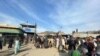 People wait to cross the Torkham border crossing between Afghanistan and Pakistan on February 24. 