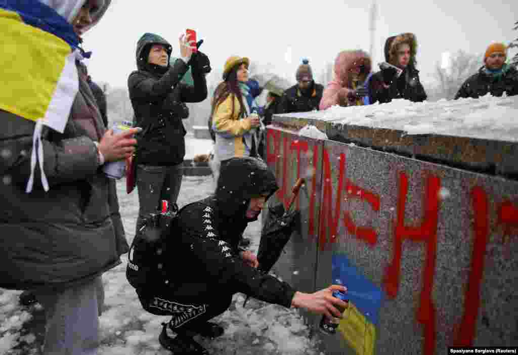 Anti-war activists deface the Soviet monument on February 27, 2022. Inside Bulgaria, opinions of Russian President Vladimir Putin were mostly positive, at up to 58 percent, between 2020 and 2022, but plummeted to just 32 percent in the days after the Ukraine invasion was launched. 