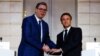 French President Emmanuel Macron (right) and Serbian President Aleksandar Vucic meet in April in Paris.