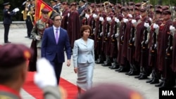 Outgoing President Stevo Pendarovski (left) turns over North Macedonia's presidency on May 12 to Gordana Siljanovska-Davkova, who won election four days earlier.