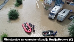 Rescuers use inflatable boats to evacuate residents from a flooded area in the city of Usuriisk on August 12.