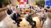 Ukrainian President Volodymyr Zelenskyy (center foreground) meets with G7 leaders at a summit in Italy earlier this year.