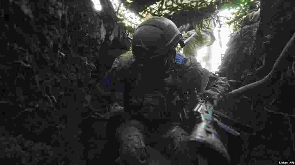 A Ukrainian soldier jumps into a trench to escape Russian shelling. "Our main task is to ensure reliable defense, to prevent the loss of our strongholds and positions in the Kupyansk and Lyman directions, as well as to successfully move forward and reach the designated lines in the Bakhmut direction," Syrskiy said.