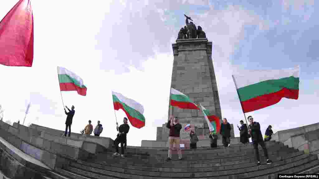 Protesters wave Bulgarian flags during the protest. The Soviet memorial is the property of Bulgaria’s central government, meaning Sofia’s mayor still needs to make a request to the regional governor to remove the contentious landmark.