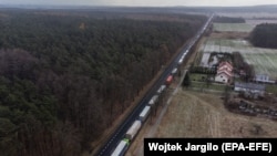 An aerial photo shows trucks standing in line at the Polish-Ukrainian border near the village of Hrebenne in southeastern Poland on November 27. 