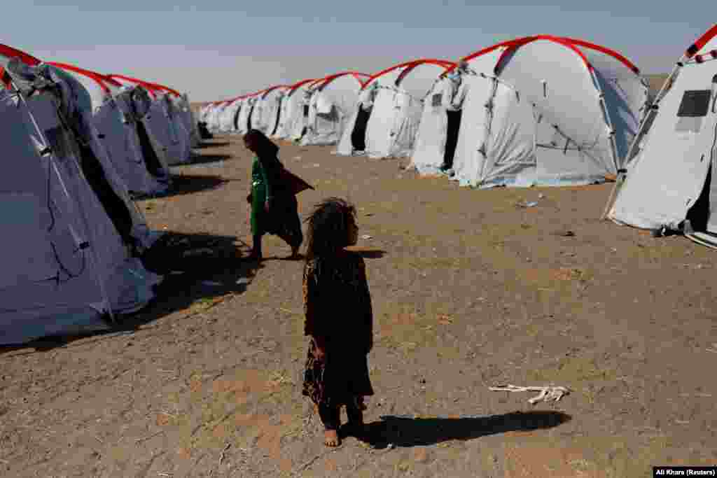 Atefeh, 6, who lost her father and brother in the recent earthquake, is now living in a tent at the Red Crescent camp near Zindah Jan on October 10. 