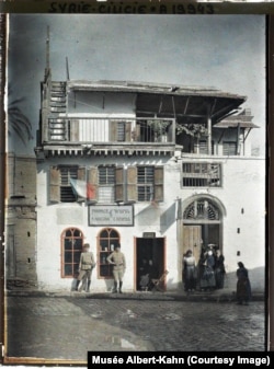 Armed men apparently guarding an Armenian pharmacy in Adana, in today's eastern Turkey, in 1919. The original caption reads: "Syria, Adana, Armenian Pharmacy."
