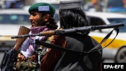 Taliban militants at a roadside checkpoint in Kabul in January.