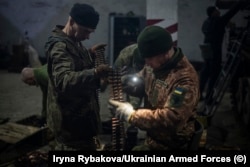 Soldiers prepare ammunition shortly before the Russian invasion in February.