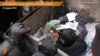 У Харкові активісти вкинули міського депутата в смітник