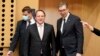 Serbian President Aleksandar Vucic (right) and European Commissioner for Neighborhood and Enlargement Oliver Varhelyi (center) arrive for a roundtable meeting during an EU summit in Kranj, Slovenia in October 2021.