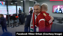 Hungarian Prime Minister Viktor Orban wears a scarf around his neck with a map of Greater Hungary at a soccer match on November 20.