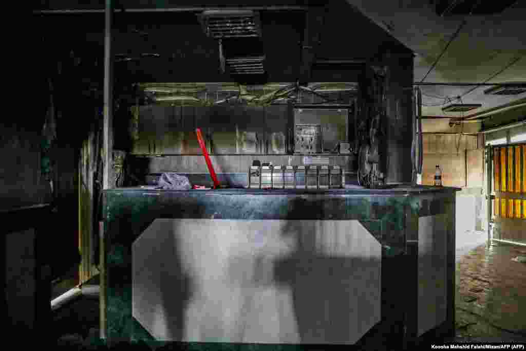 Fire damage seen inside Evin prison on October 16. Tehran Governor Mohsen Mansuri claimed the blaze was caused by "a fight between some prisoners" in a sewing workshop. That claim was widely disputed on Iranian social media but amid restrictions on Internet and communications, much about the deadly violence remains unclear. 