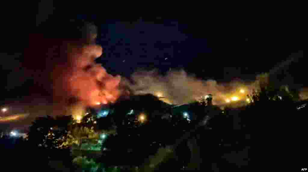 On October 15, several videos emerged showing flames billowing above the prison, in the northwest of Tehran. Apparent gunfire and explosions can be heard in some of the amateur footage. The blaze came amid deadly unrest across Iran following the death of Mahsa Amini in September. Amini, 22, died after being detained by Iran's morality police for allegedly not wearing her Islamic head scarf, or hijab, properly. 