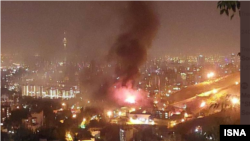 A screen-grab from an Iranian video that appears to show smoke rising from Tehran's Evin prison on October 15. 