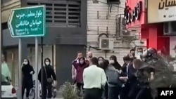 A video from October 12 shows female protesters being roughly handled by Iranian security forces in the city of Rasht, in Iran's northern Gilan Province.