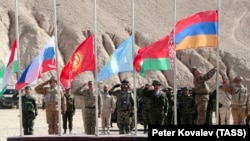TAJIKISTAN - National flags of Tajikistan, Russia, Kyrgyzstan, Kazakhstan, Belarus and Armenia (L-R) are flown during a CSTO military exercise held near the Afghan border, October 18, 2021: