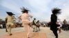 Afghan men perform the traditional "attan" dance in Kabul, April 17 2014.