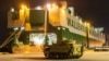 A Ukraine-bound Bradley fighting vehicle proceeds to load onto a carrier in North Charleston, South Carolina, on January 25.