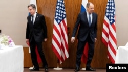 U.S. Secretary of State Antony Blinken and Russian Foreign Minister Sergei Lavrov move to their seats before a meeting in Geneva on January 21, 2022, almost a month before Russia launched its full-scale invasion of Ukraine.