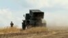 grab Grad rocket system and Ukrainian soldier