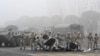 Troops are seen on Almaty's main square, where hundreds of people were protesting against the government after the authorities' decision to lift price caps on liquefied petroleum gas, on January 6, 2022. 