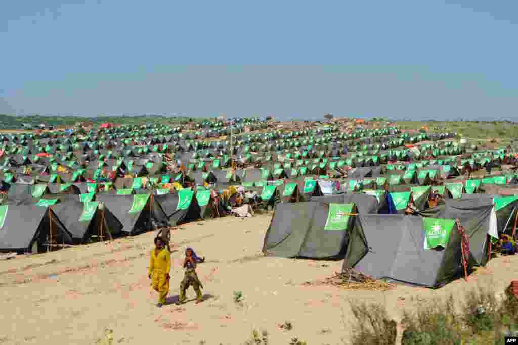 Internally displaced people at a camp in Sindh Province on September 19. More than 300 people have died from disease since July 1 and more than 2.7 million have been treated for water-borne illnesses at makeshift and mobile hospitals, according to Reuters. 