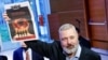 Dmitry Muratov, editor in chief of Novaya gazeta, poses after auctioning off his 2021 Nobel Peace Prize in New York on June 20. He donated the proceeds to raising money for Ukrainian child refugees. 