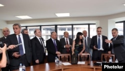 Armenia - Representatives of the governing coalition and the opposition Armenia National Congress begin landmark negotiations in Yerevan, 18Jul2011.