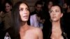 Kim Kardashian (left) and her sister, Kourtney (file photo)