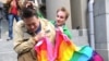 A man (right) attacks a gay rights activist in central Moscow. Antigay attitudes are still quite prevalent in much of Russia. 