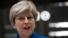 British Prime Minister and leader of the Conservative Party Theresa May makes a statement outside 10 Downing Street in London on June 9.