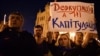 UKRAINE – Ukrainians hold banner reading 'Deoccupation but not capitulation!' during their protest against signing 'Steinmeier formula' in Minsk, near of the Presidential office in Kyiv, October 2, 2019