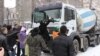 Armenia - Environmental activists stop a truck delivering concrete to a construction site in a central Yerevan park, 17Feb2012.