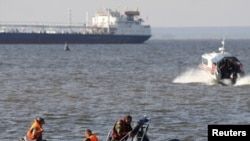 Survivors say two vessels passed them in the water without stopping to help.