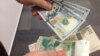 Қурби расмии доллар ба 7,11 сомонӣ расид