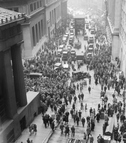 A crowd gathers outside the New York Stock Exchange on October 29, 1929, as the stock market lost nearly one-quarter of its value in two days.