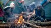 Migrants gather in a tent camp on the Belarusian-Polish border.