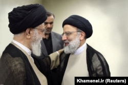 Iranian Supreme Leader Ayatollah Khamenei (left) with Ebrahim Raisi (file photo)