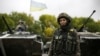 Жінка-воїн в зоні бойових дій неподалік від селища Луганське Донецької області, 24 вересня 2014 року
