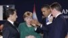 Președintele Nicolas Sarkozy, Cancelarul Angela Merkel, președintele Barack Obama și premierul David Cameron discutînd înaintea deschiderii lucrărilor în plen la summitul G20