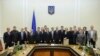 Ukraine -- New prime minister Arseny Yatseniuk (10th R) and his ministers pose for a picture during a meeting in Kyiv, February 27, 2014