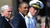 U.S. President Barack Obama (center) was flanked at a tribute in June by outgoing Defense Secretary Robert Gates (left) and Admiral Mike Mullen, both of whom concluded the repeal wouldn't harm the military.